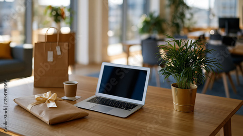 Upscale online shopping workspace featuring laptop, elegant wrapping paper and shopping bag, bright office environment, wide composition,, presented in stunning high resolution for professional use