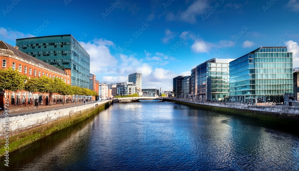 Fototapeta premium modern buildings and offices on liffey river in dublin