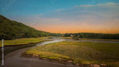 Принти на полотні Connecticut marshland landscape on the shore with wild seagrass and curved river