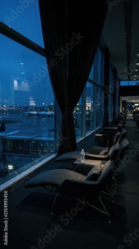 Elegant Airport Lounge Overlooking Nighttime Runway Views