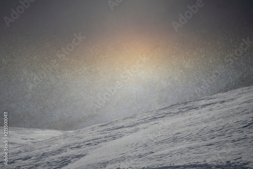 A rainbow made from small snowflakes and the sun, at the top of a mountain at Voss in Norway. 