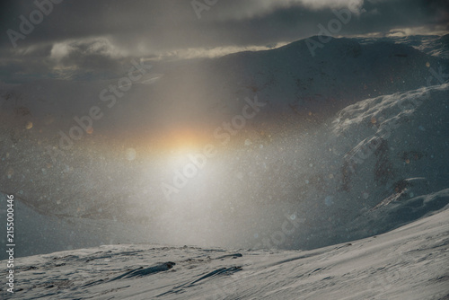 A rainbow made from small snowflakes and the sun, at the top of a mountain at Voss in Norway. 