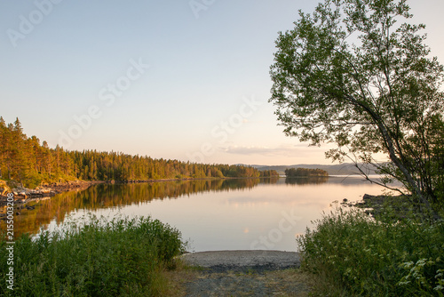 Bild auf Leinwand Golden Evening Light over Lake Totak in Rauland, Norway