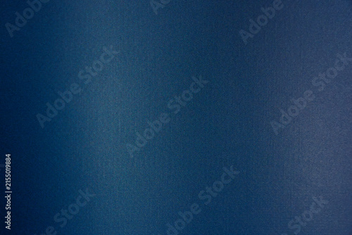 Dark blue surface presenting a subtle gradient and fine grain texture