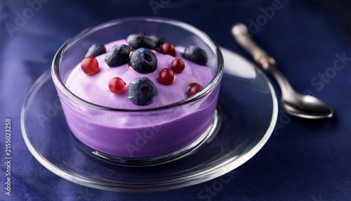 delicious purple dessert in a glass bowl featuring creamy texture with hints of vanilla and berries perfect for food photography