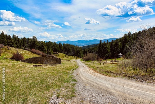 Down the Dirt Road View of Kendall Montana Ghost Town including the General Store and the Bandstand and to the Mountains Beyond.