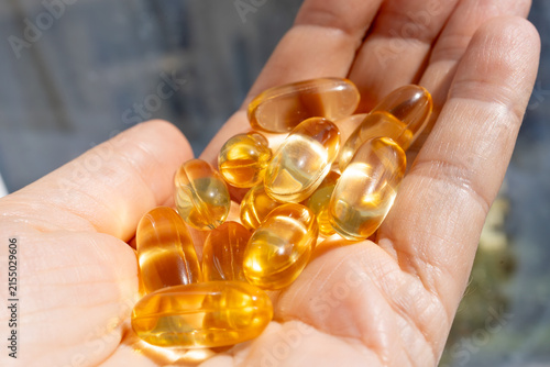Omega 3 yellow gel capsules, vitamin d bg