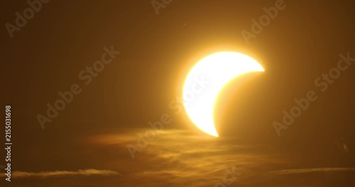 Partial Solar eclipse during a sunset on 12th of August 2026 behind a forest in rural Estonia, Northern Europe