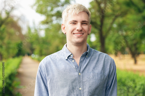 Portrait of smiling man wearing shirt in park