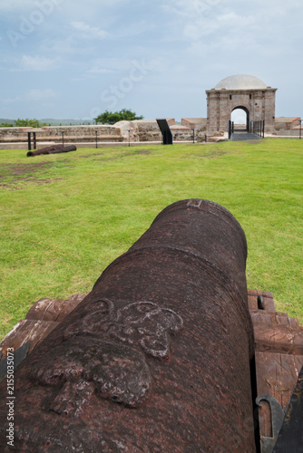 Close-up of historic cannon barrel leading to gatehouse at Fort San Lorenzo