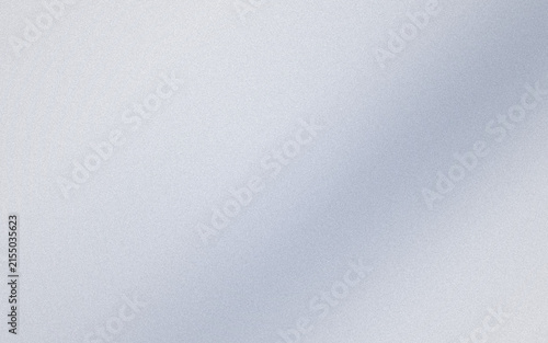A soft and subtle diagonal beam of light cutting across a textured, light grey and white grainy background surface