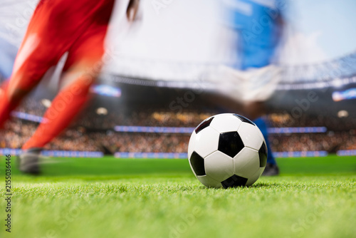 Фотография Soccer player shows strong ball control and fast dribbling across the pitch, using agile football footwork to beat an opponent in a one-on-one duel during a dynamic attacking run with motion blur