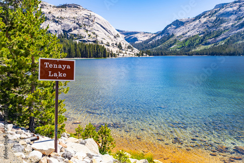 Tenaya Lake sign with granite domes backdrop