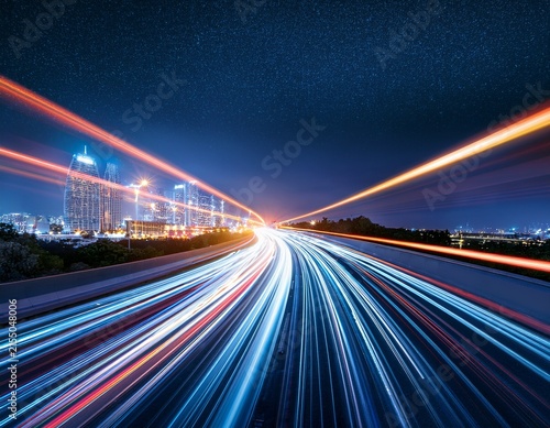 long exposure car light trails on urban highway at night for motion background banner and speed design with dynamic neon streaks