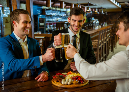 Businessmen Toasting Beer Together.