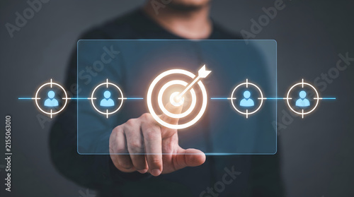Professional businessman using a digital interface to select specific target audience segments for data driven marketing growth and strategies