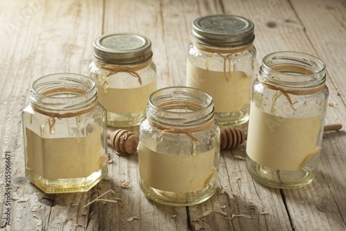 Multiple honey jars rustic wood shelf