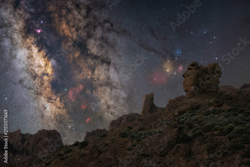 View of the Queen's Shoe rock formation under the Milky Way galaxy in the night sky in La Orotava, Canarias, Spain.