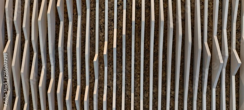 Obraz na plátne Textured wall panel with parallel vertical white slats arranged in varying thickness and spacing, creating a wave‑like rhythm
