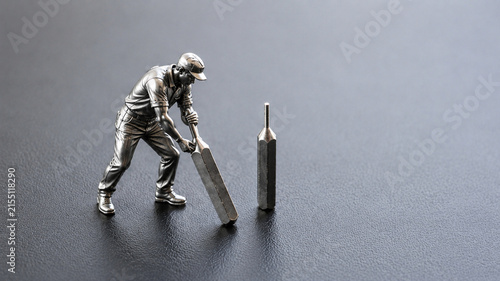 Silver Worker Using Metal Lever to Move Steel Pin on Dark Industrial Surface