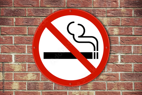 no smoking sign on a brick wall background