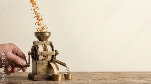 Person's hand pressing a coffee grinder to visualize food-system efficiency with a recognizable miniature grain mill mechanism