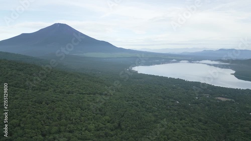 Aerial drone footage of Mount Fuji and lake Yamanaka on a summer morning, Yamanashi