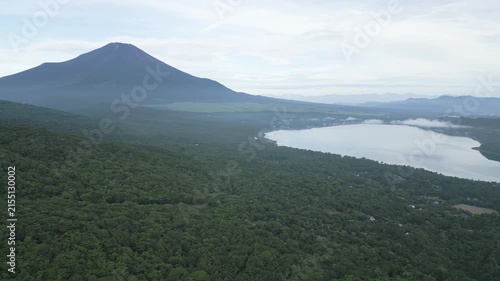 Aerial drone footage of Mount Fuji and lake Yamanaka on a summer morning, Yamanashi