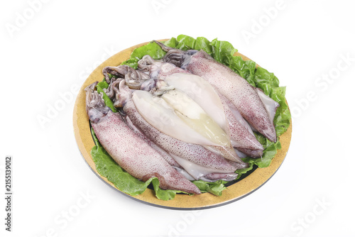 Fresh Whole Squid on Wooden Plate with Lettuce Garnish Raw Seafood Preparation