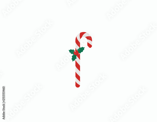 Foto Christmas Candy Cane: A festive Christmas candy cane adorned with a sprig of holly, symbolizing holiday cheer and sweet tradition