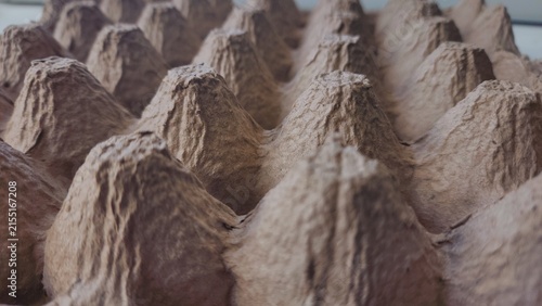 Canvastavla Close up of a brown cardboard egg carton with textured cups in a repeating patte