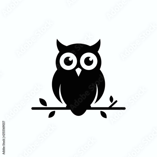 Black owl silhouette perched on a leafy branch.