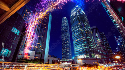 Obraz na plátně Vibrant night cityscape with glowing lights and modern skyscrapers