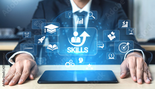 Businessman Interacting with Digital Icons Representing Skill Development and Learning Opportunities in Modern Technology and Education Environments Quark.
