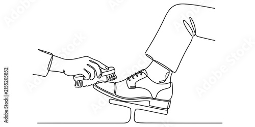 Continuous line drawing of a person getting their leather shoe cleaned by a professional shoe shiner with a brush