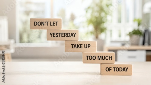 Steps to a Brighter Tomorrow: Wooden blocks arranged in a stair formation, each bearing a word of inspiration, encourage forward momentum and a focus on the present.