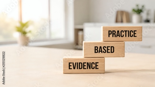 Evidence Based Practice Wooden Blocks: Wooden blocks stacked to form a staircase with the words EVIDENCE, BASED, and PRACTICE inscribed on them, symbolizing progress and knowledge application.