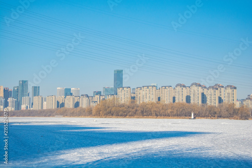 Shenyang Skyline Across Frozen Hun River in Winter