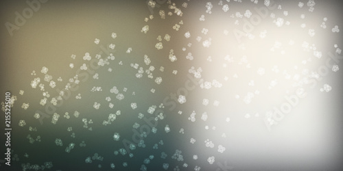 Abstract background with white floating particles over gradient colors.