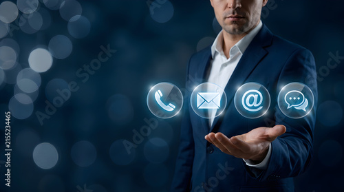 Businessman holding digital contact icons for call mail at symbol and chat message customer service support connection concept