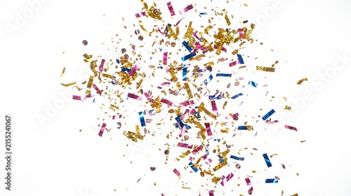 Festive colorful confetti pieces scattered over plain white background