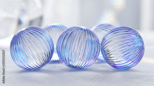 Blue textured glass spheres on a white surface.