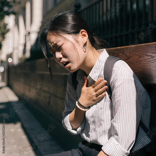 Woman Feeling Breathless During a Moment of Physical Discomfort