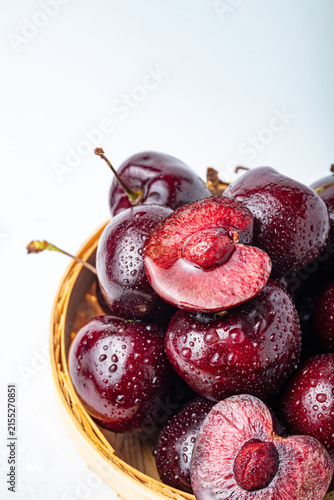 Fresh Sweet Cherries in Basket on White Background
