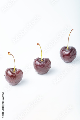 Three Fresh Cherries Isolated on White Background