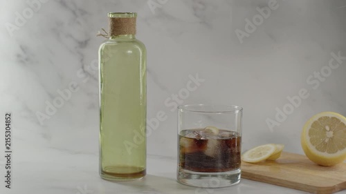 Adding lemon in glass. Original sound. 24fps. Prores 422HQ