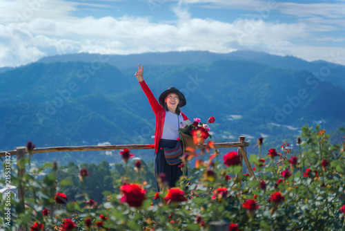 Rose Garden Asian Woman Enjoying Colorful Flowers with Mountain Landscape in Chiang Mai, Northern Thailand