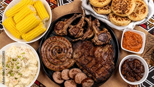 Traditional South African Braai Spread with Boerewors, Grilled Meats, Sweetcorn, and Potato Salad