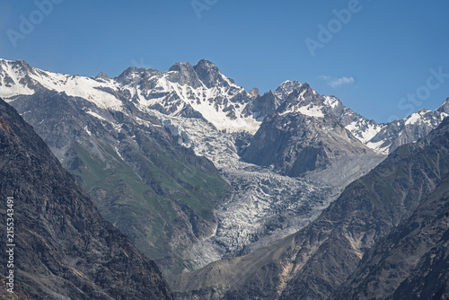 Scenic landscape view of glacier and snowcapped mountain peak in mighty Karakoram range, Shigar, Gilgit Baltistan, Pakistan	
