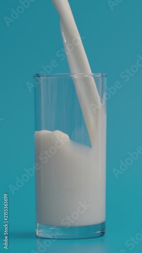 Slow Motion of Milk Pouring in Glass at 1000 fps, Vertical Video